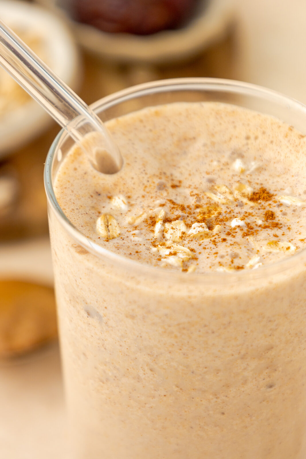 close up of oatmeal cookie smoothie with cinnamon and oats as garnish
