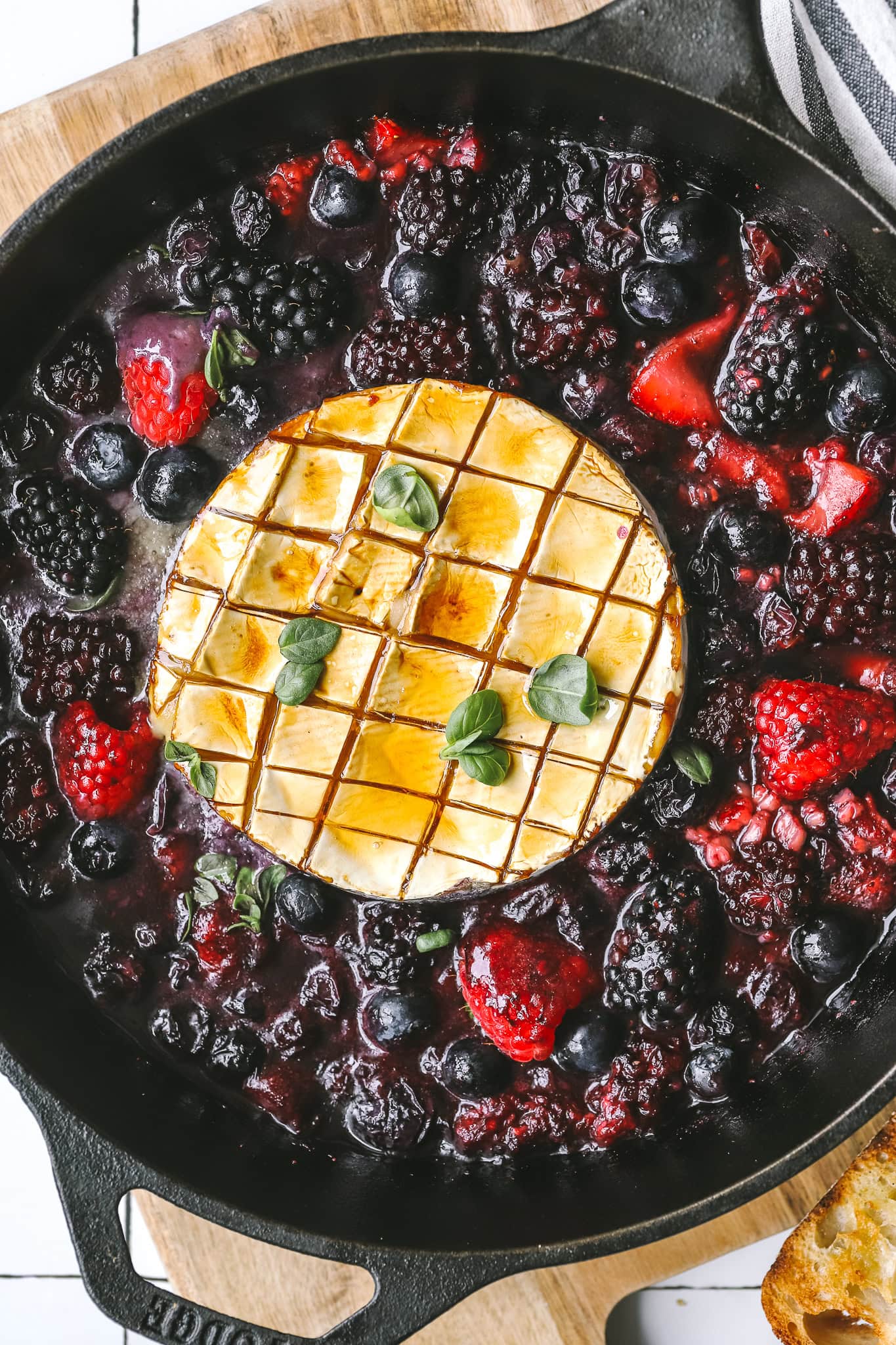 close up of grilled brie and berries